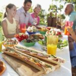 Familiy enjoying lunch in second home in France bought with SCI